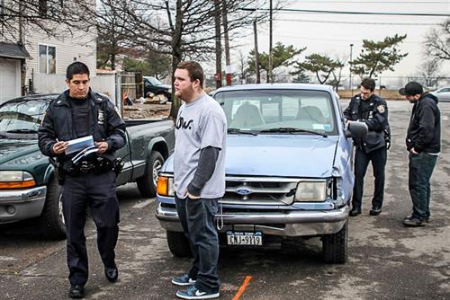 Taurozzi (in black) and friend, Zack Schwartz making a report of stolen tools & belongings with officers who responded from the 122 Precinct